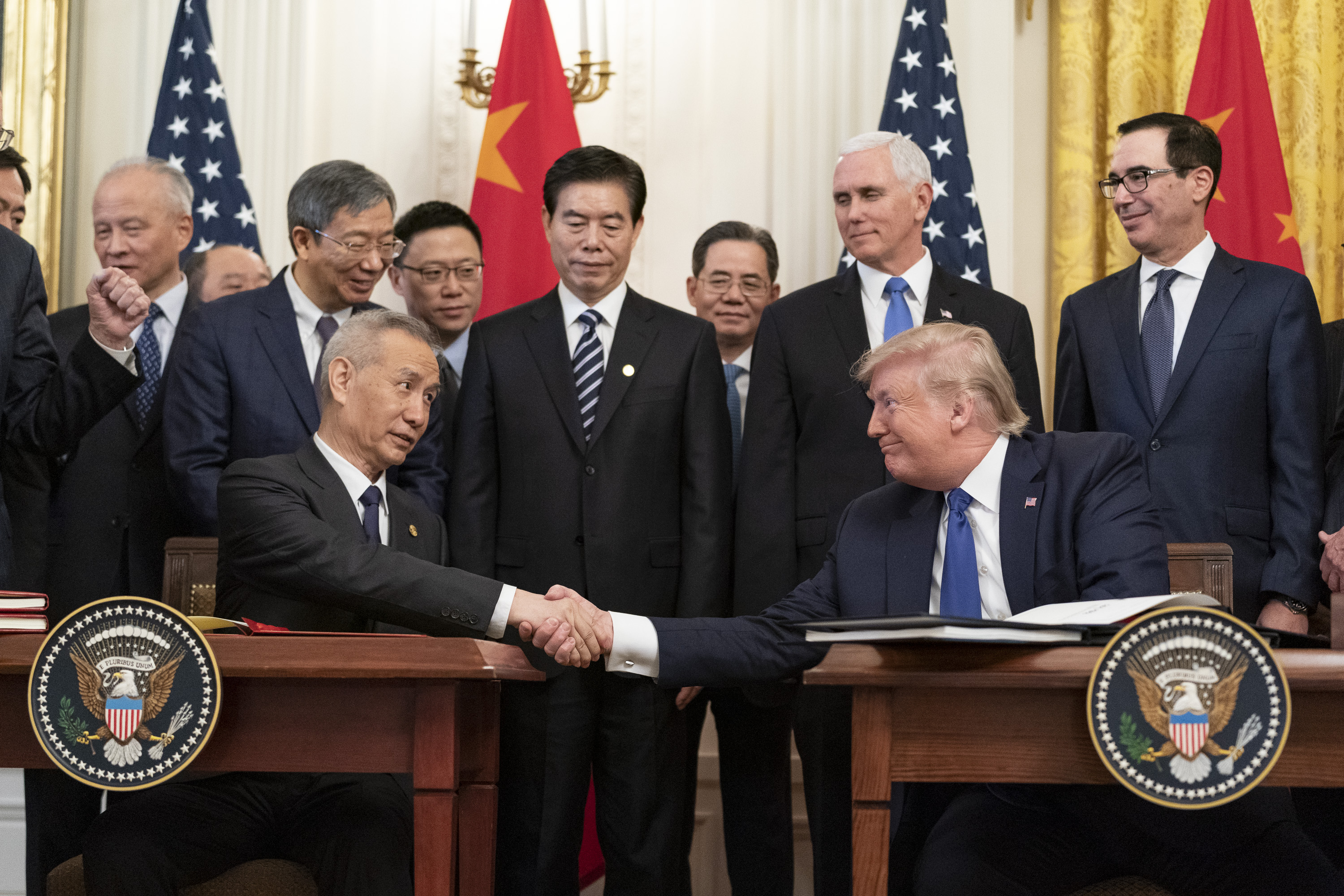 President Trump and Vice Premier of China sign trade deal.