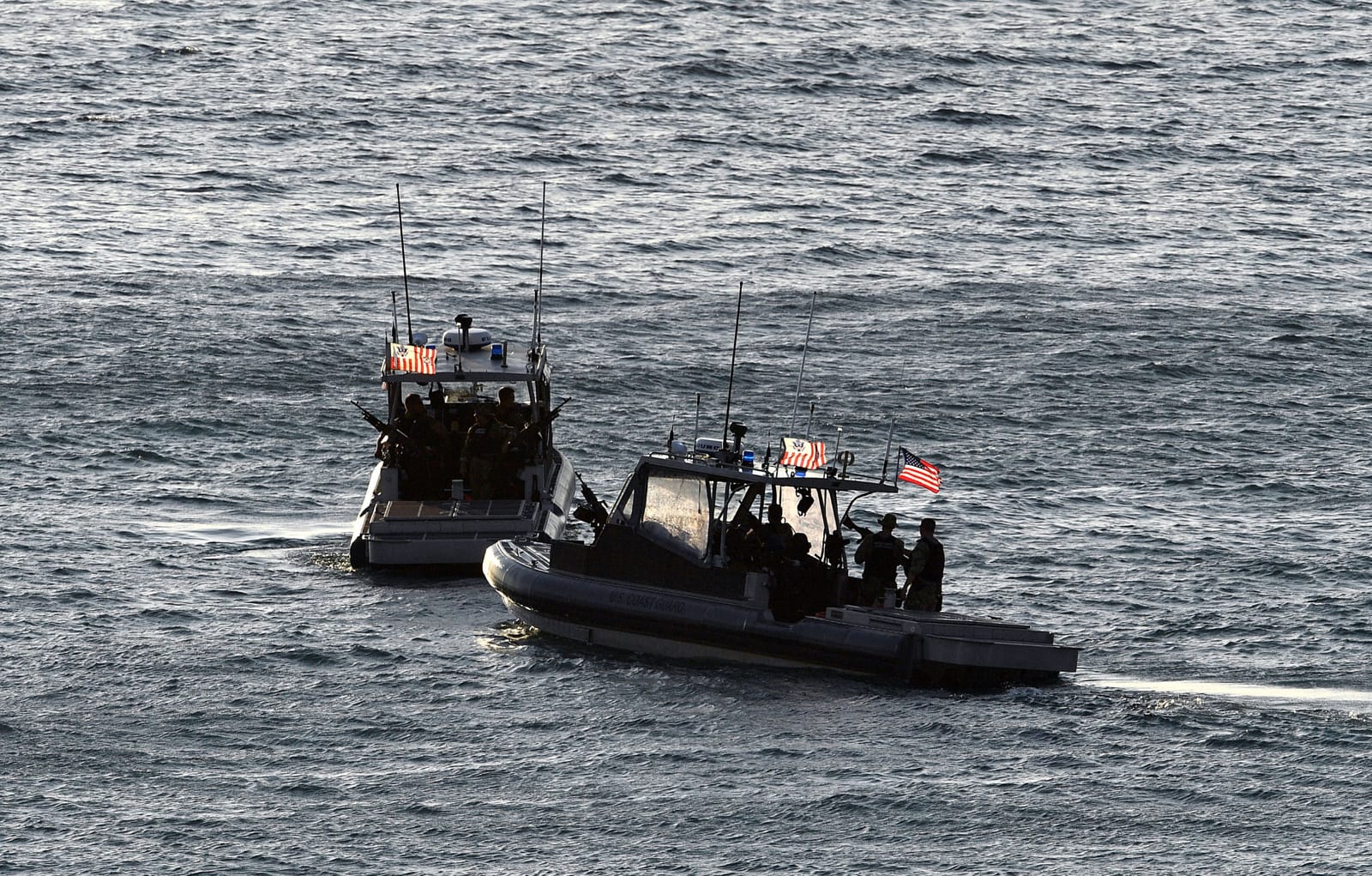 United States coast guards patrol the harbour ahead of the 2018 APEC summit in Port Moresby (Saeed Khan/AFP via Getty Images)