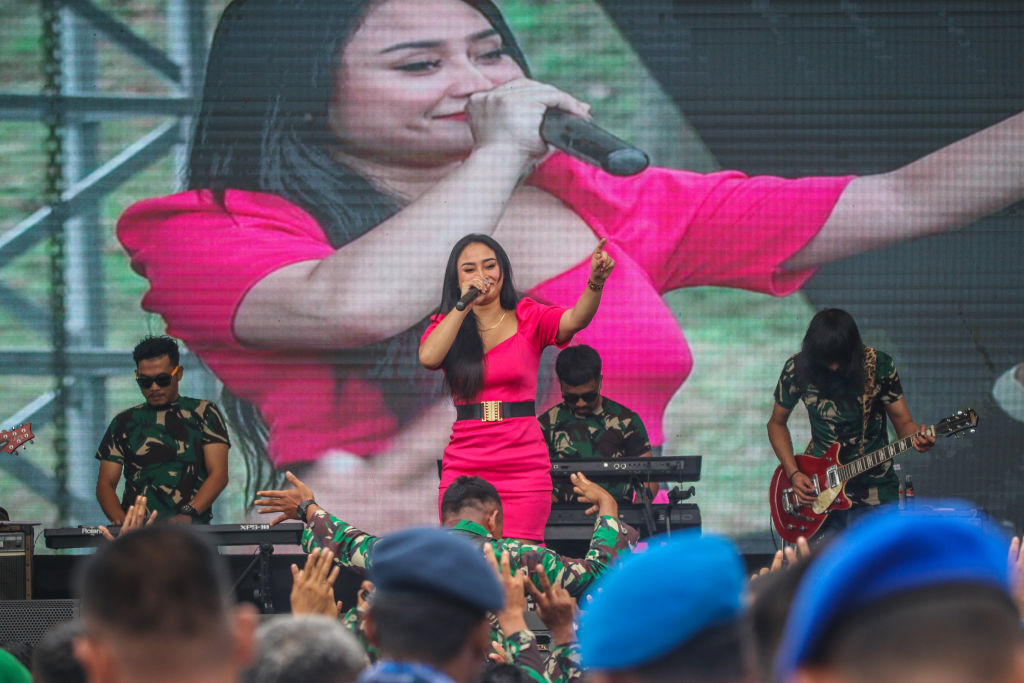 The dangdut band “Ken Arok” perform for Indonesian troops in October in Semarang (WF Sihardian/NurPhoto via Getty Images)