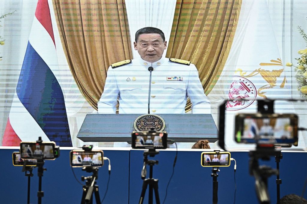 Thailand's new Prime Minister Srettha Thavisin is pictured on a large screen in the media room as he makes a speech at a royal ceremony to be appointed in his role at the Pheu Thai party headquarters in Bangkok (Lillian Suwanrumpha/AFP via Getty Images)
