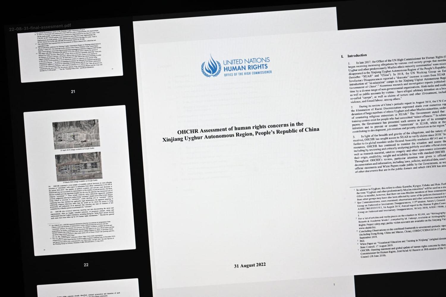 Pages of a long-delayed report on human rights in China's Xinjiang region released just minutes before UN rights chief Michelle Bachelet left her post (Fabrice Coffrini/AFP via Getty Images)