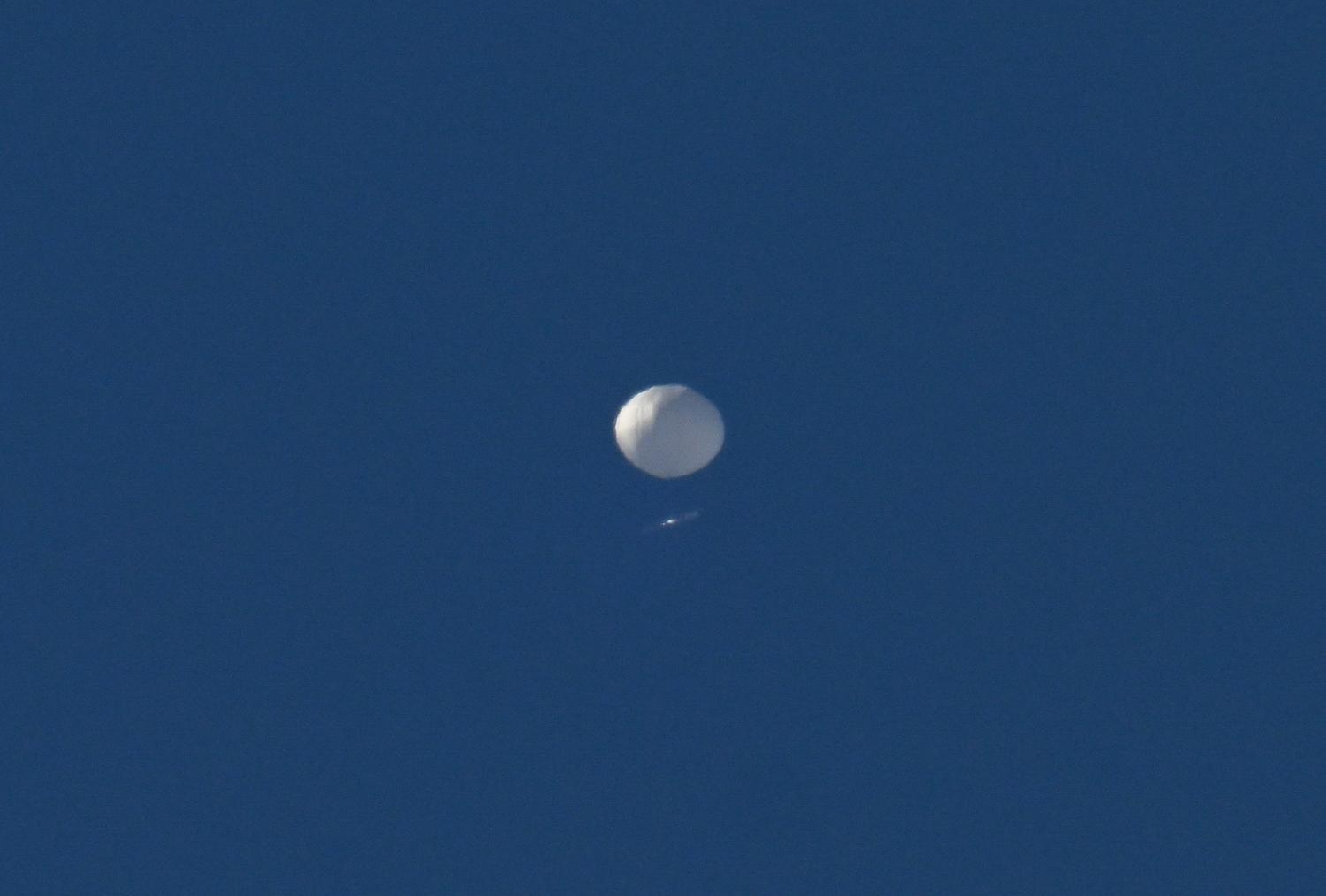 A Chinese spy balloon flies above Charlotte, North Carolina, United States on 4 February. The balloon was later shot down (Peter Zay/Anadolu Agency via Getty Images)