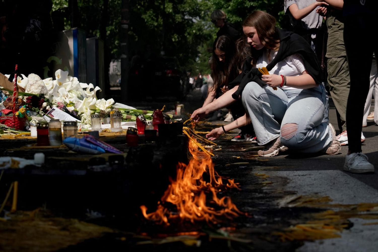 Flowers and candles for the victims outside the Vladislav Ribnikar elementary school in the Serbian capital Belgrade following a mass shooting last week (Oliver Bunic/AFP via Getty Images)