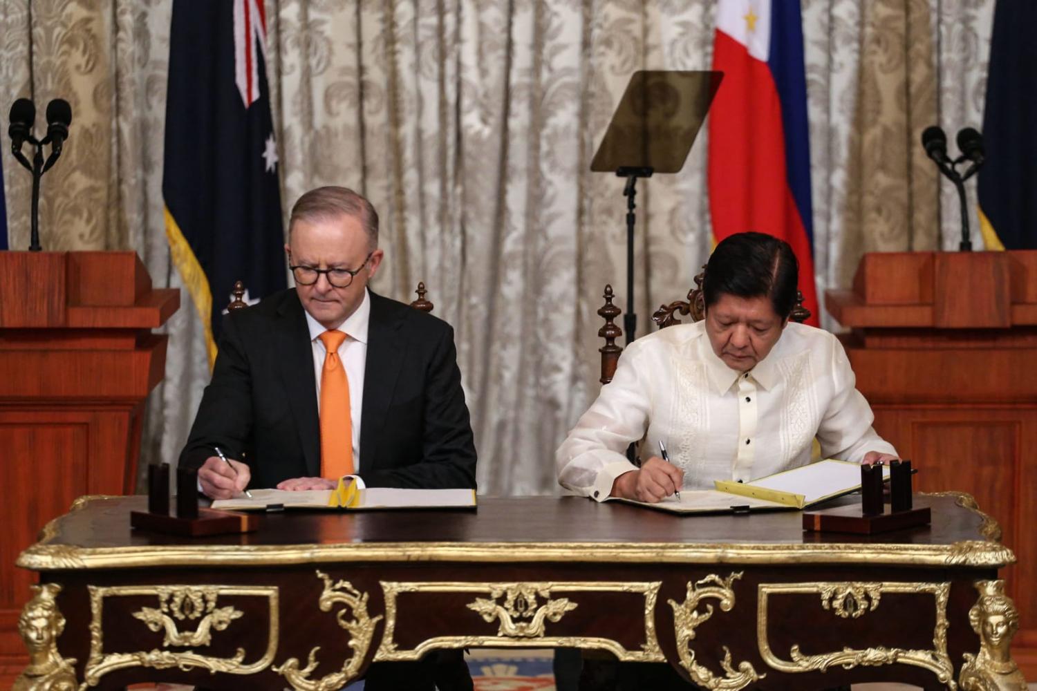 Australia's Prime Minister Anthony Albanese, left, and Philippines' President Ferdinand Marcos Jr. sign a Memorandum of Understanding at the Malacanang Palace in Manila in September this year (Earvin Perias via AFP/Getty Images)