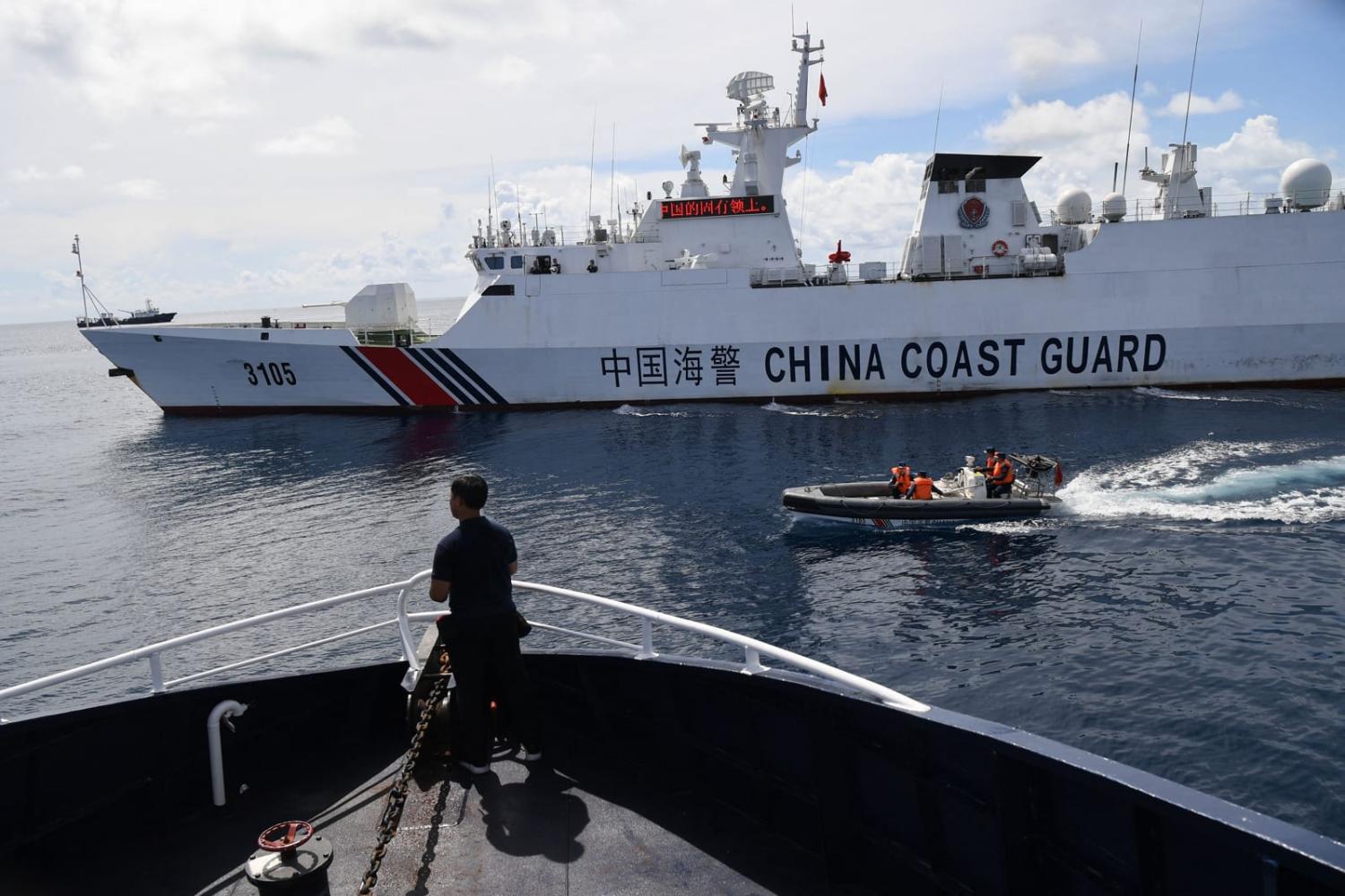 A Chinese Coast Guard ship last month impeding a Philippine Bureau of Fisheries and Aquatic Resources vessel near Scarborough Shoal (Ted Aljibe/AFP via Getty Images)