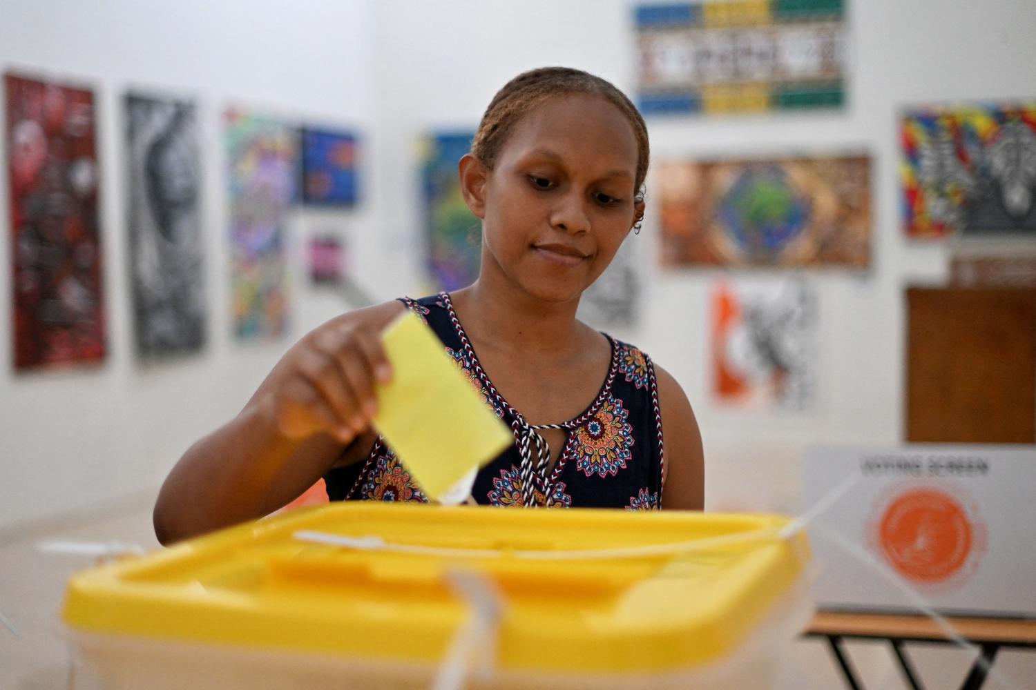 A woman casts her vote during the general elections in Honiara on 17 April. (Saeed KHAN/Getty)