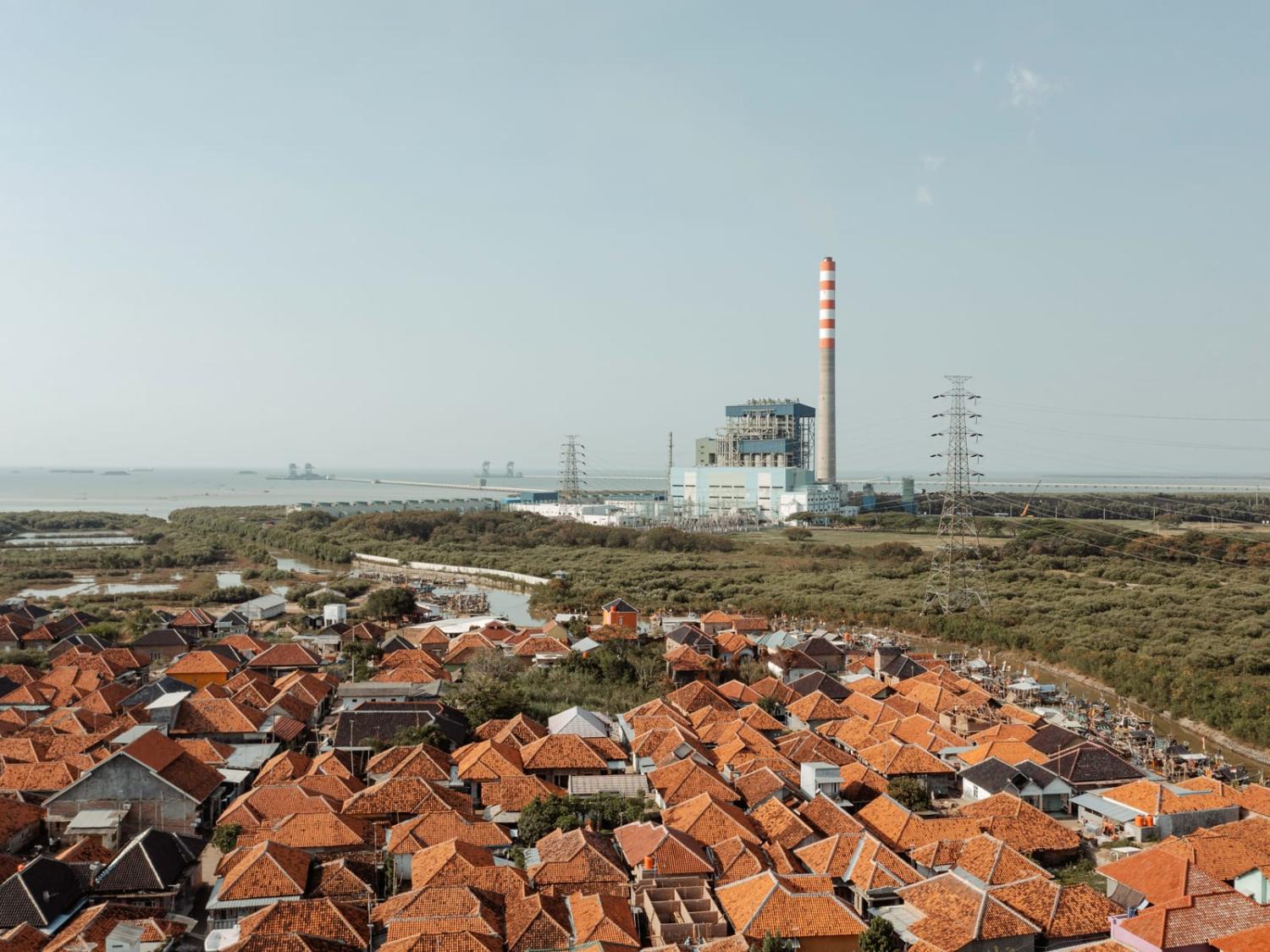 The fishing village of Waruduwur and the nearby Cirebon-1 coal-fired power plant in Cirebon, West Java, Indonesia (Muhammad Fadli/Bloomberg via Getty Images)