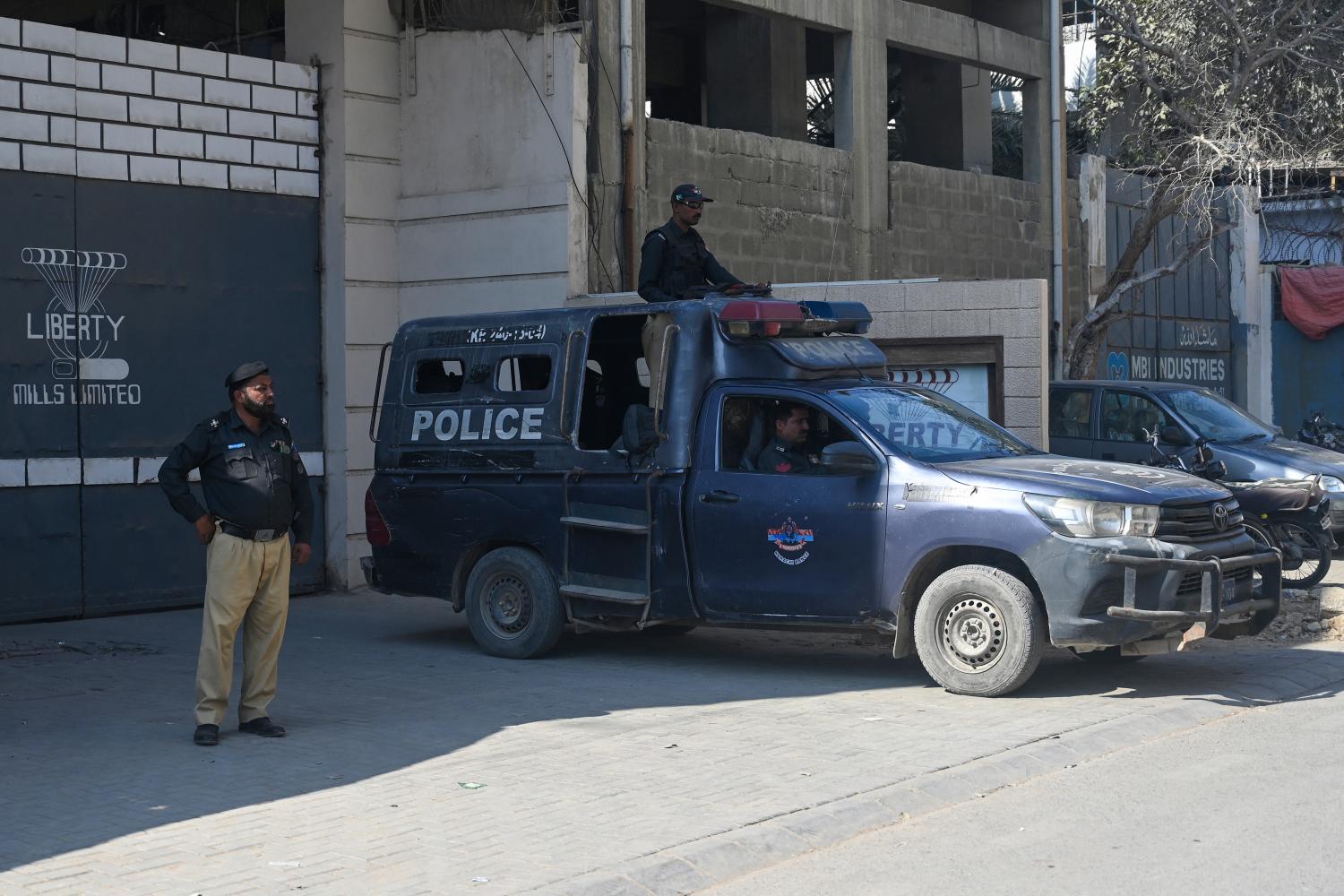 Pakistan police guard a factory where two Chinese nationals were allegedly shot, in Karachi on 5 November 2024 (Rizwan Tabassum/AFP via Getty Images)