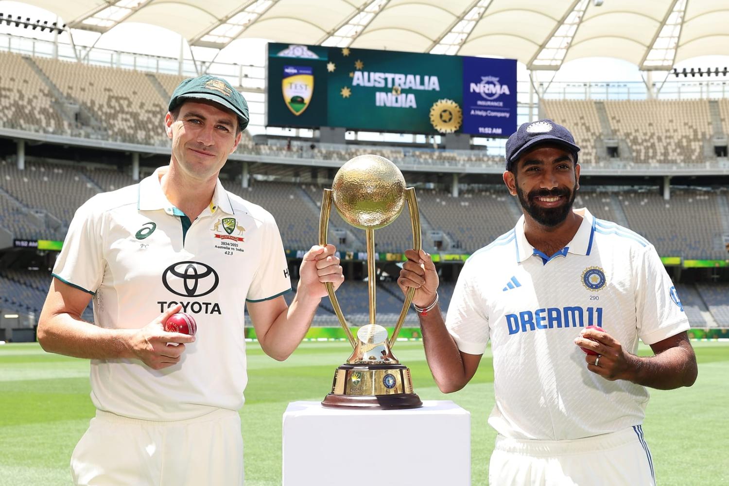 Pat Cummins of Australia and Jasprit Bumrah of India pose with the Border-Gavaskar Trophy ahead of the series First Test Match between Australia and India at Optus Stadium in Perth (Paul Kane/Getty Images)