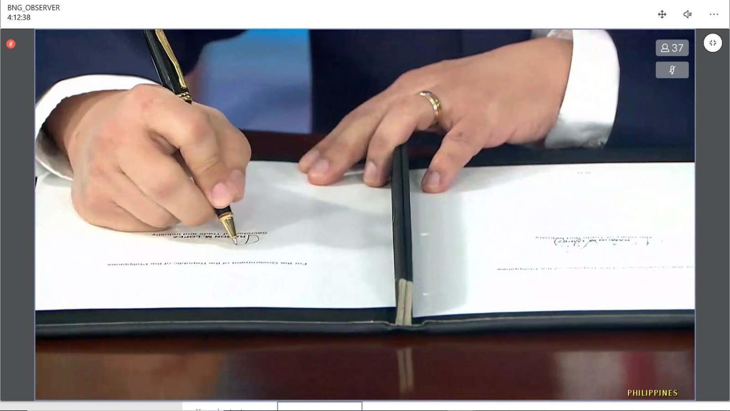 Philippines Trade Secretary Ramon Lopez puts pen to paper in the virtual signing ceremony for RCEP (Kusuma Pandu WIjaya/ASEAN Secretariat)