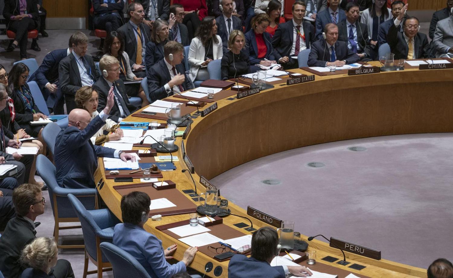 Representatives of Russia and China raise their hands to veto a UN Security Council resolution on Syria (Photo: Cia Pak/United Nations)