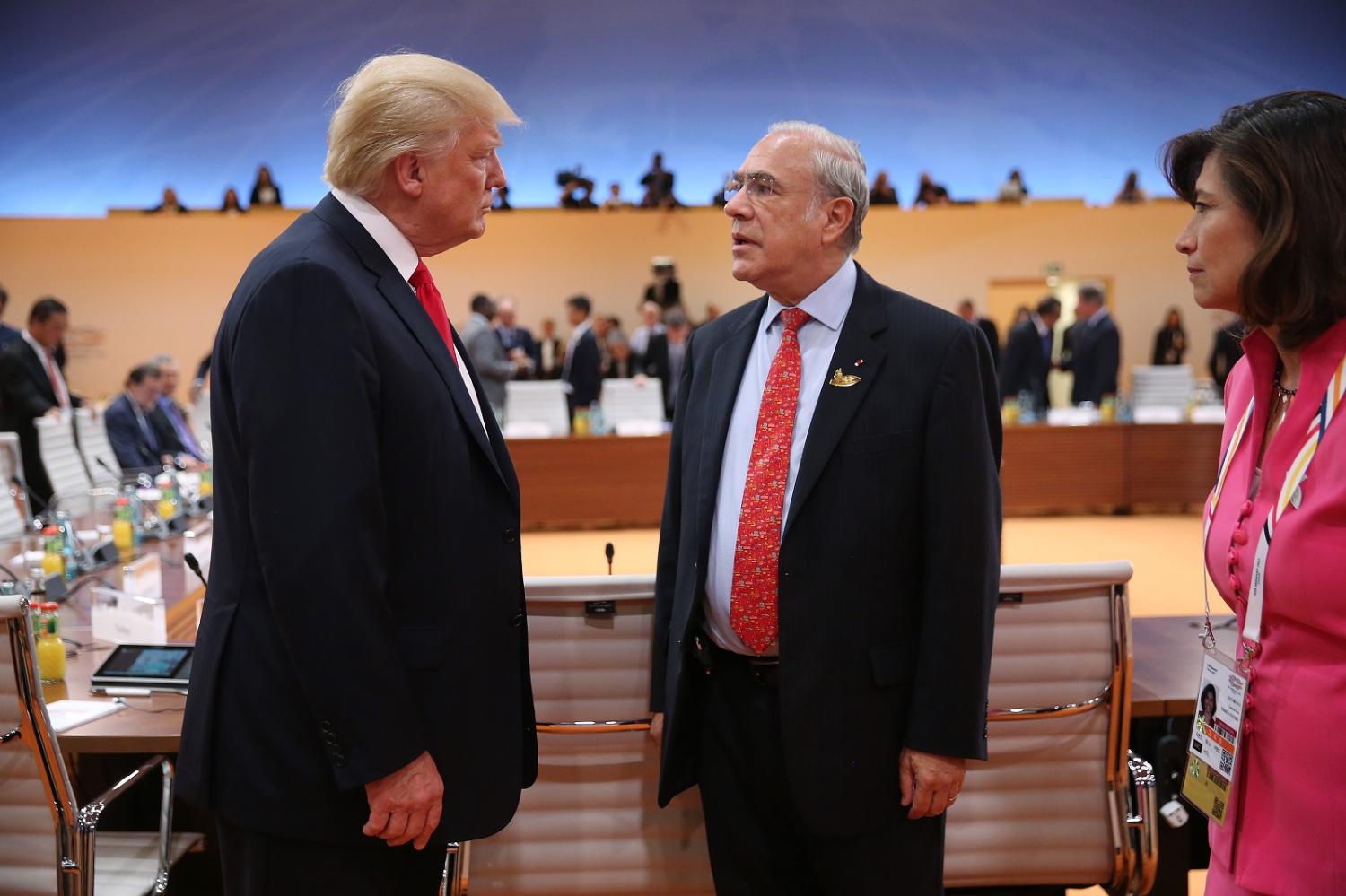 US President Donald Trump with OECD Secretary-General Angel Gurria at the G20 leaders meeting in Hamburg on 8 July. (Photo by Sean Gallup/Getty Images)