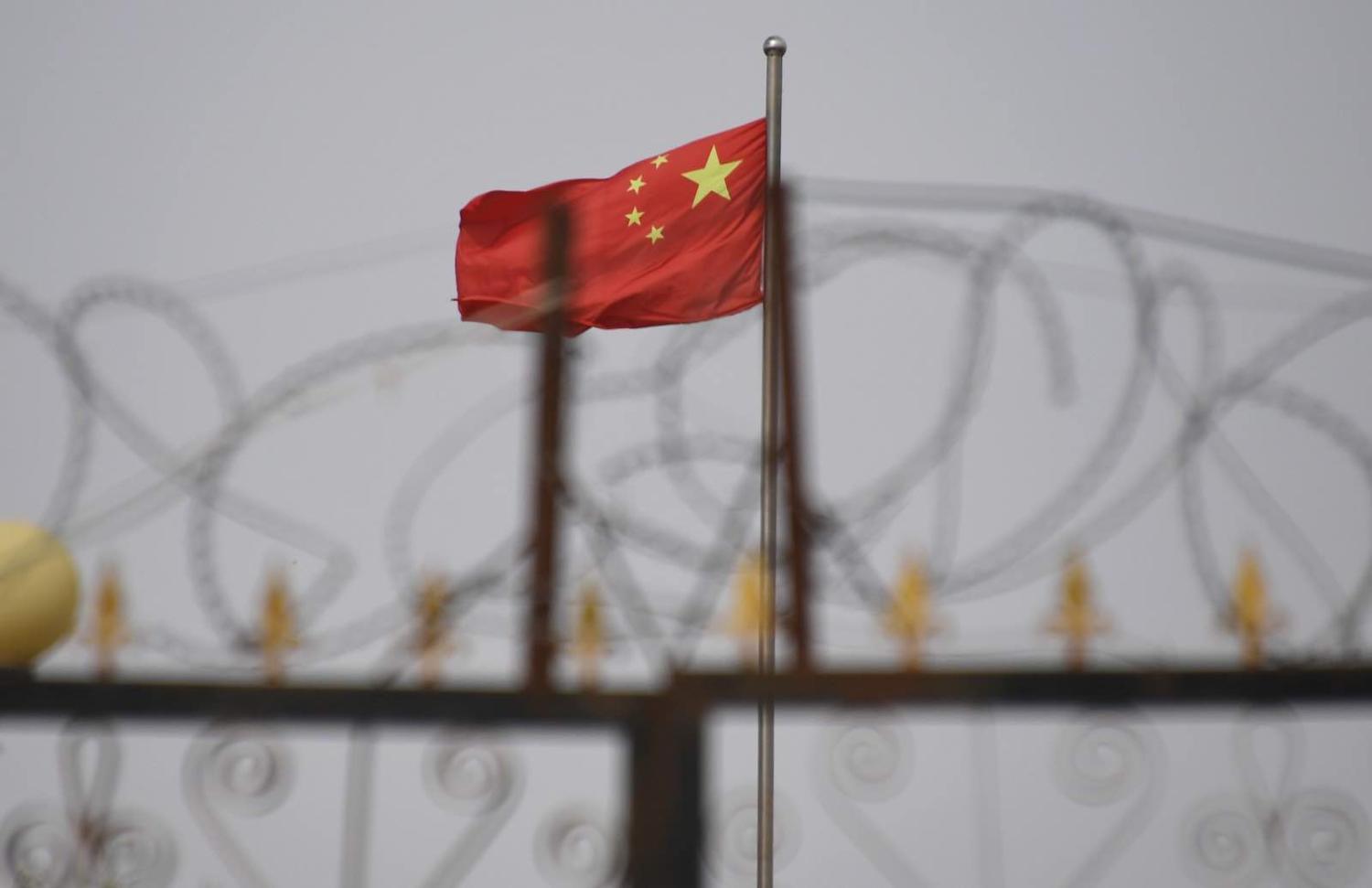 Behind razor wire at a housing compound in Yangisar, south of Kashgar, in China's western Xinjiang region (Greg Baker/AFP via Getty Images)