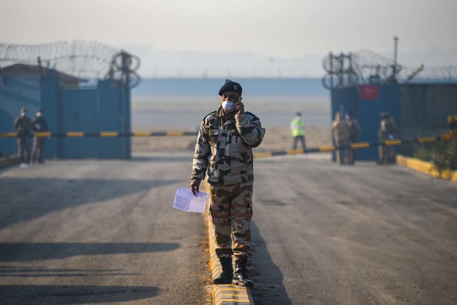 A guard at Indira Gandhi International Airport following the evacuation from Wuhan province in China (Amal KS/Hindustan Times/Getty Images)