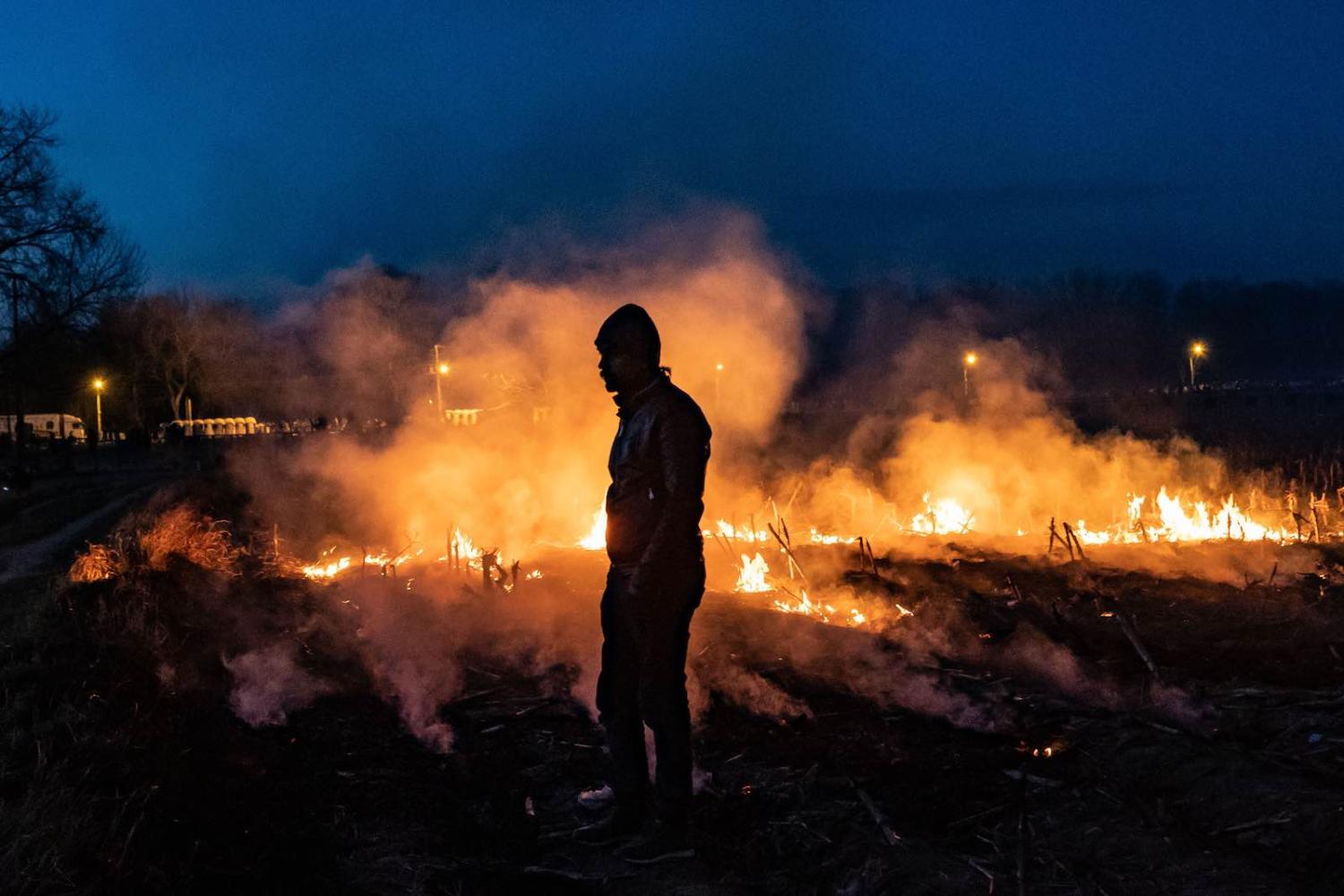 A migrant in the Turkish province of Edirne, bordering Greece, 7 March 2020 (Yasin Akgul/Picture Alliance via Getty Images)
