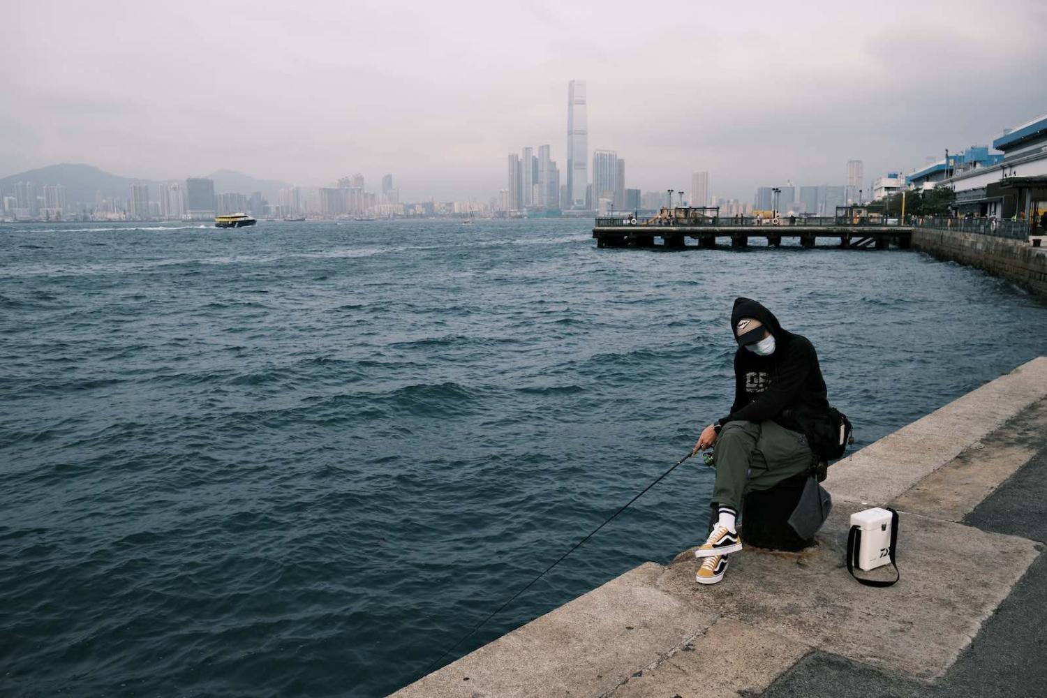 A trip getting out of the apartment has never been so meticulous: face mask and hand sanitiser are must-have items in the bag (Anthony Wallace/AFP/Getty Images)