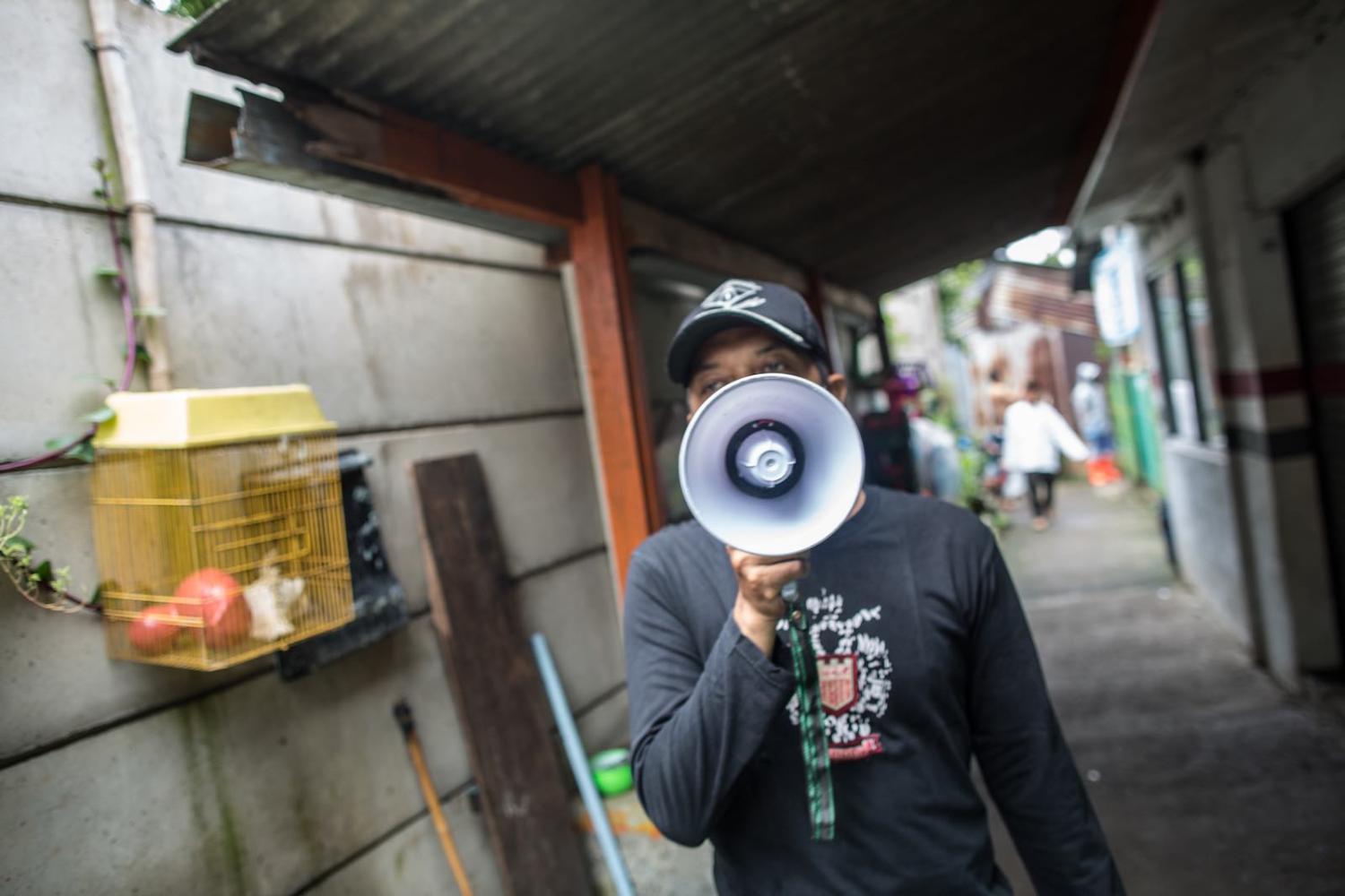 Sounding the alarm – an official broadcasts social distancing regulations in Jakarta (Afriadi Hikmal/NurPhoto via Getty Images)