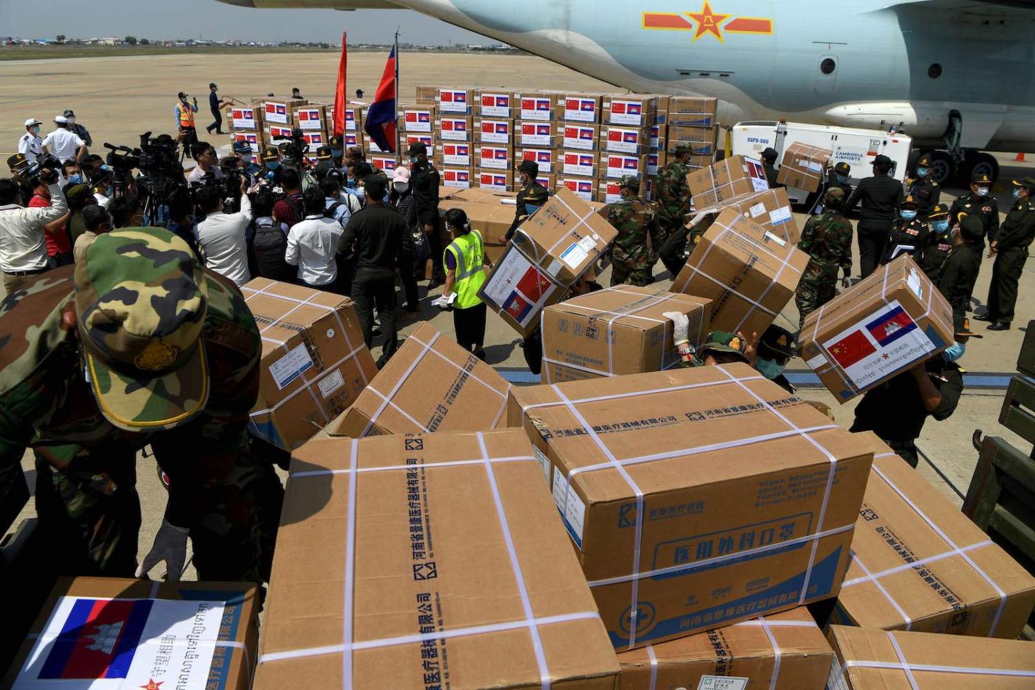 Cambodian soldiers carry aid including medical equipment from China to be used to combat the spread of the Covid-19, Phnom Penh, Cambodia (Tang Chhin Sothy/AFP via Getty Images)