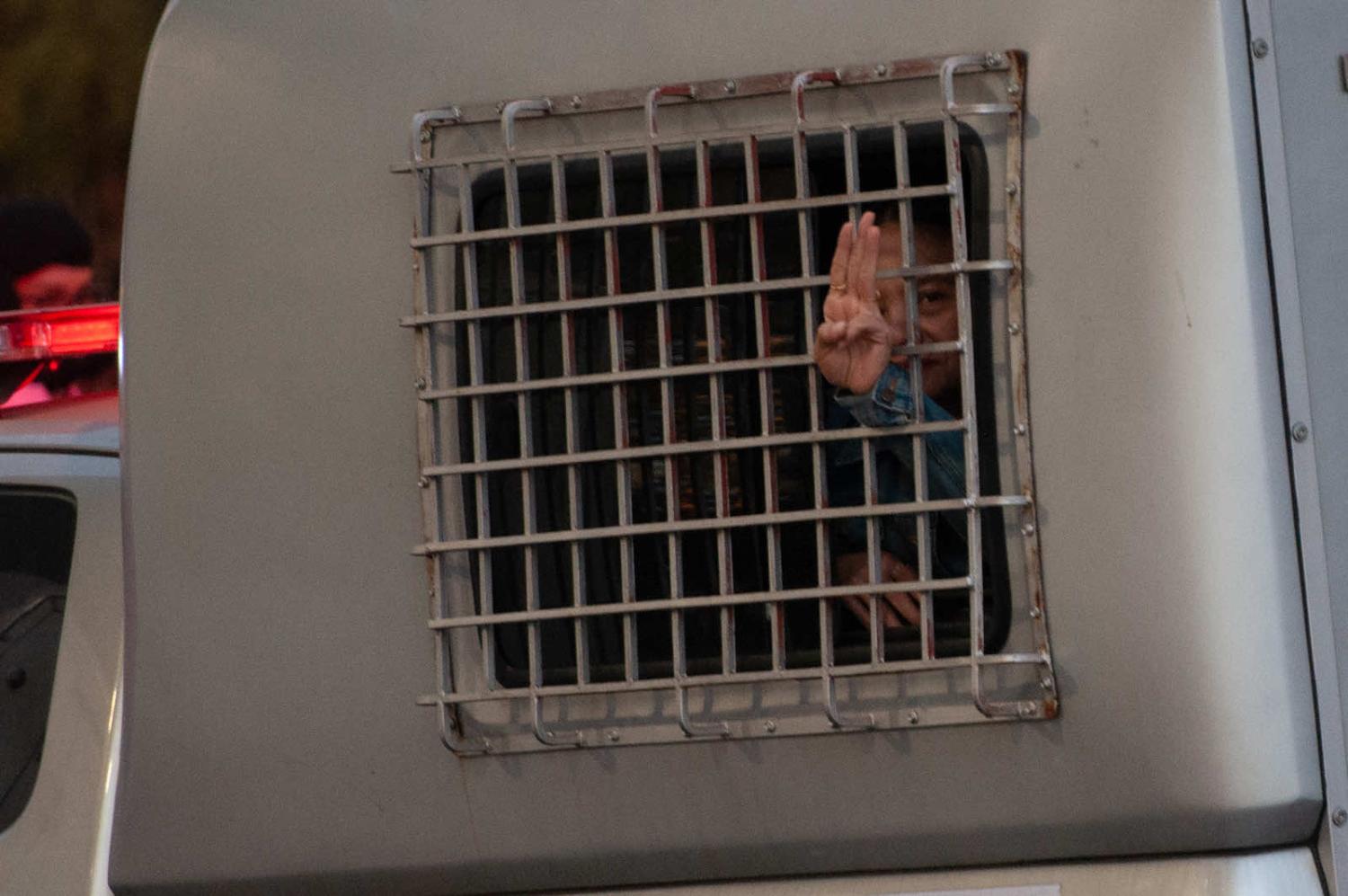 A monarchy reform activist is detained in a police prison car in January. The recent release of several prominent student activists has bought to light the scale of the current outbreak in Thailand’s prisons (Vachira Vachira/NurPhoto via Getty Images)