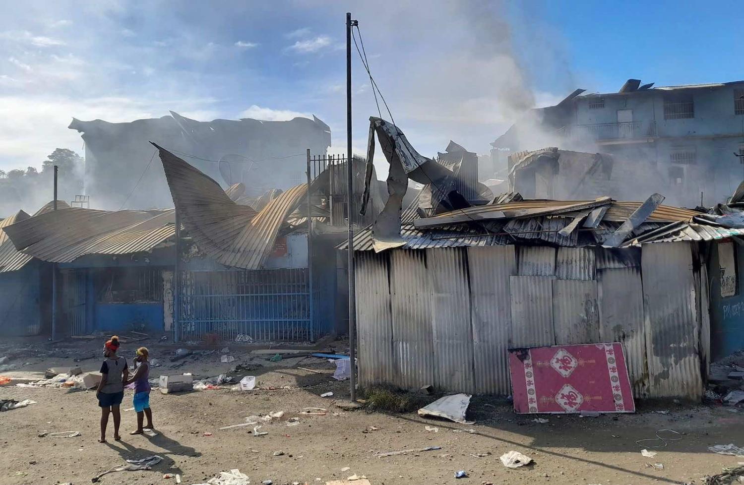 Burnt out buildings in Honiara’s Chinatown on November (Charley Pringi/AFP via Getty Images)