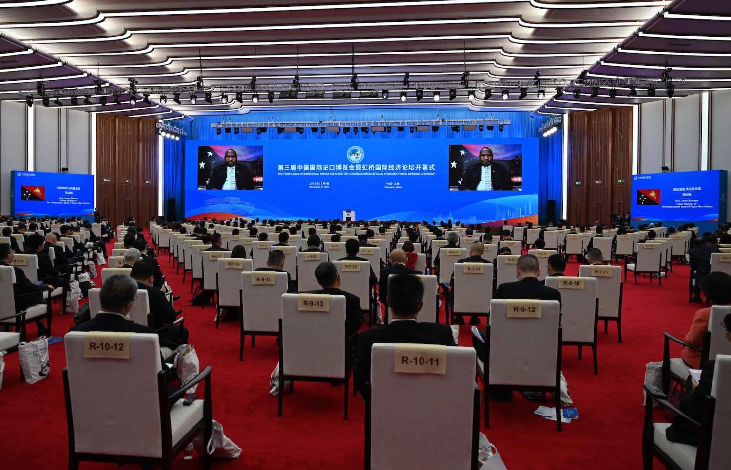 PNG Prime Minister James Marape delivers a speech onscreen at the 3rd China International Import Expo, 4 November 2020 in Shanghai, China (Photo by Mao Jianjun/China News Service via Getty Images)