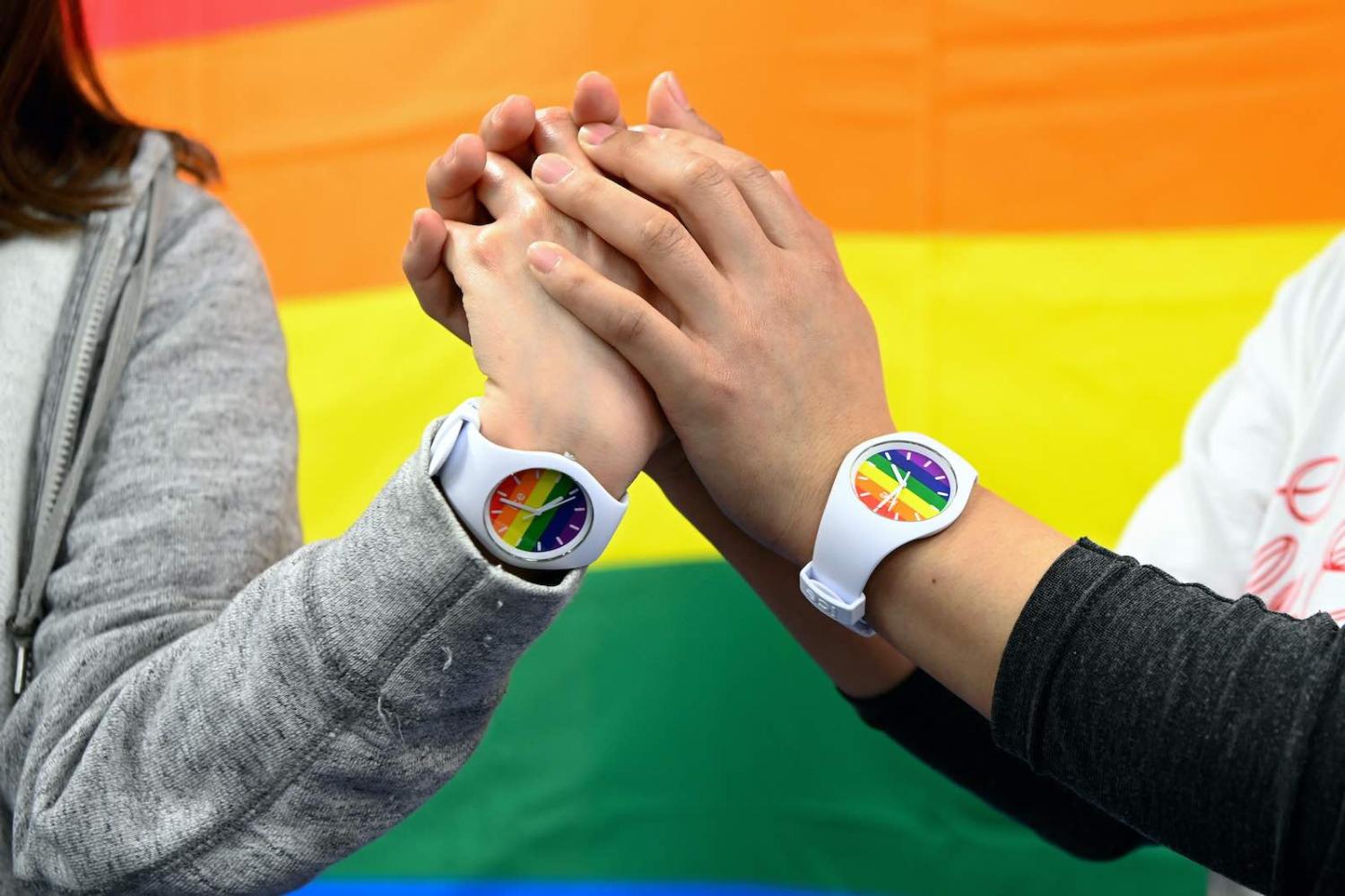 A same-sex couple at a press conference following a ruling by the Sapporo District Court on 17 March 2021 that a ban on same sex marriage was unconstitutional (The Asahi Shimbun via Getty Images)