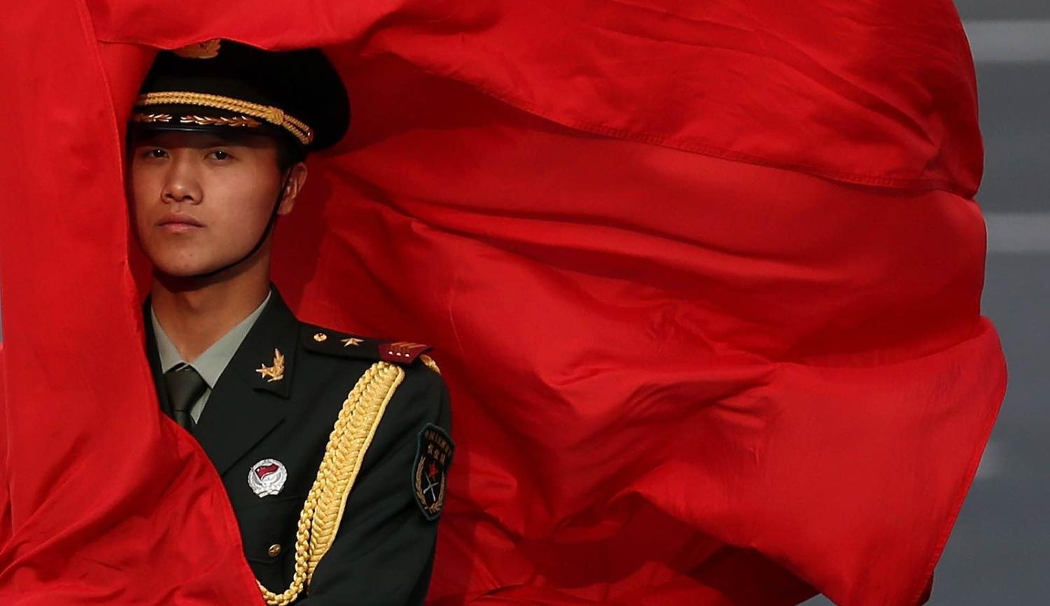 An honour guard outside the Great Hall of the People, Beijing, in 2013 during a visit by then prime minister Julia Gillard (Photo by Feng Li/Getty)