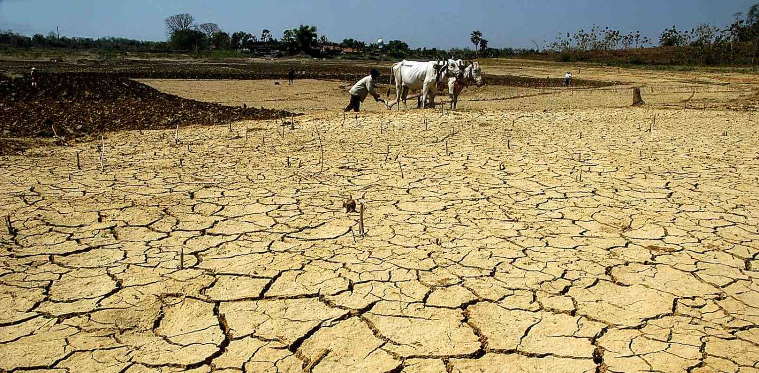 A farmer works a dried-out field in Central Java, Indonesia (Photo: Wf Sihardian via Getty)