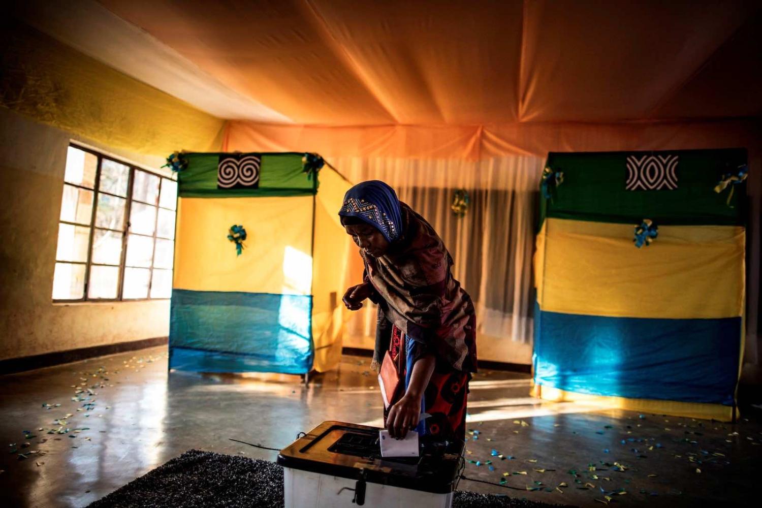 A woman casts her vote at a polling station in Kigali on 4 August 2017 (Marco Longari/AFP via Getty Images)