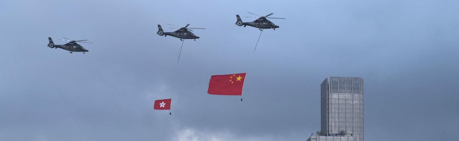 Towing the Chinese and Hong Kong flags to celebrate China's national day in Hong Kong (Photo: Anthony Wallace via Getty)