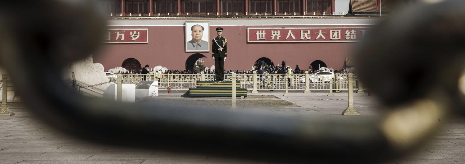 A member of the People's Armed Police in front of a portrait of former Chinese leader Mao Zedong at the Tiananmen Gate in Beijing (Photo: Qilai Shen/via Getty Images)