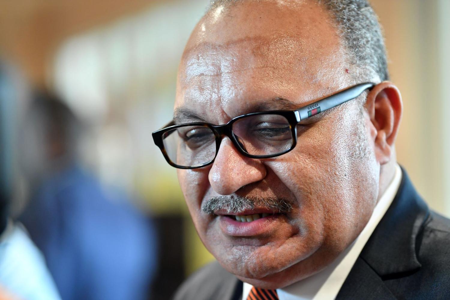 Under pressure: Peter O'Neill addressing the media at the APEC conference in 2018. (Photo: Saeed Khan/Getty)