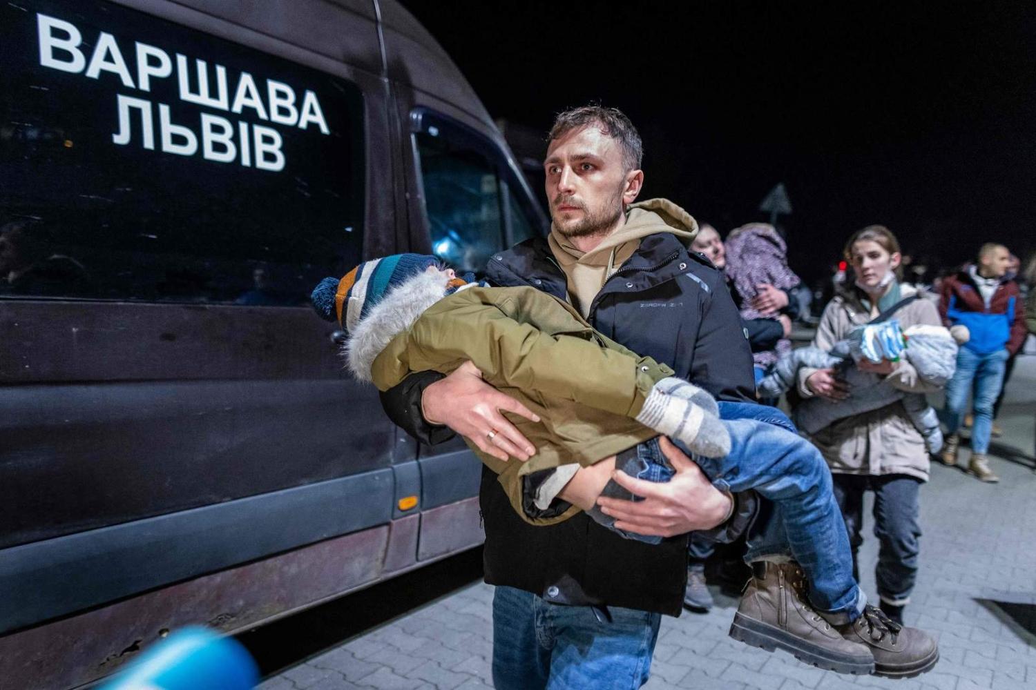 Streams of people in cars and on foot are crossing into Hungary, Poland and Romania. Przemśyl, eastern Poland, at the Medyka pedestrian border crossing, 25 February (Wojtek Radwanski/AFP via Getty Images)