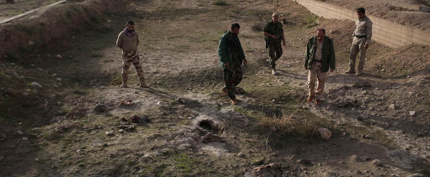 Kurdish Peshmerga show what they say is a mass grave of more than 50 Yazidis killed by ISIL on November 15, 2015 in Sinjar, Iraq. Photo: Getty Images/John Moore