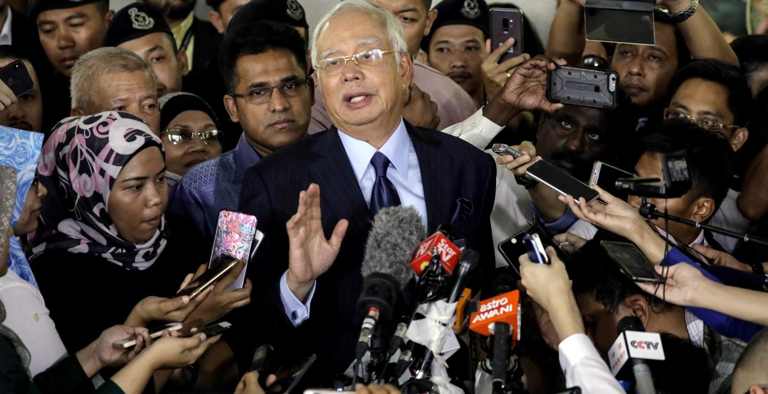 Najib Razak speaks to the media as he leaves the Kuala Lumpur Courts on 20 September. (Getty/Joshua Paul)