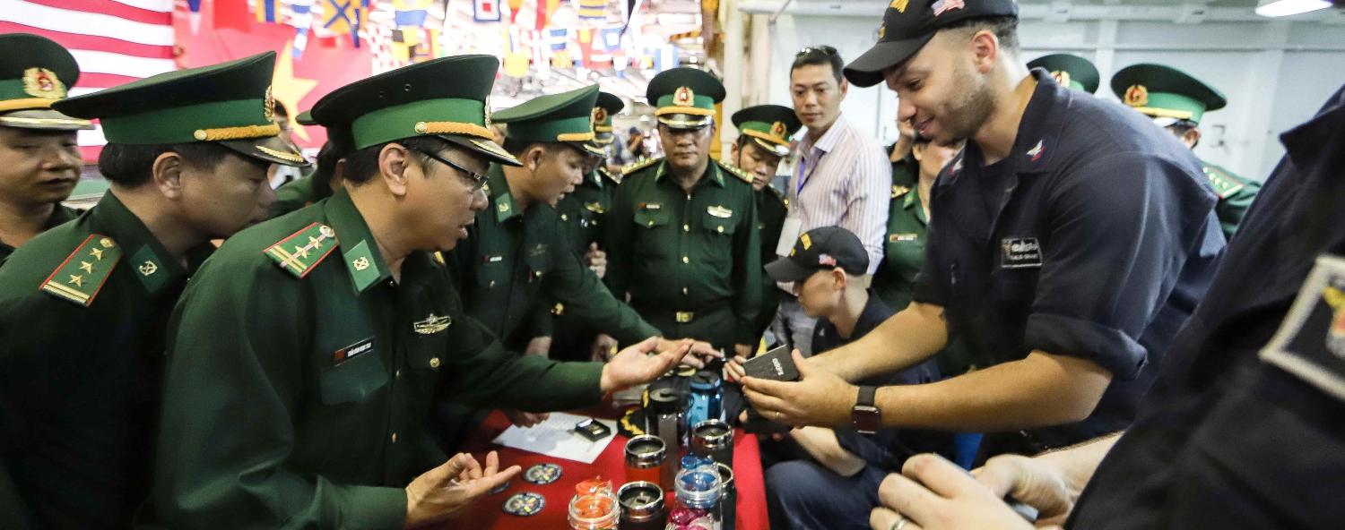 Vietnamese military officers aboard the USS Carl Vinson. (Photo: Getty Images)